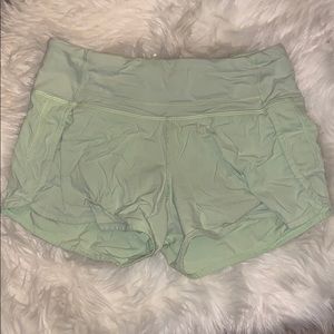 green lululemon shorts